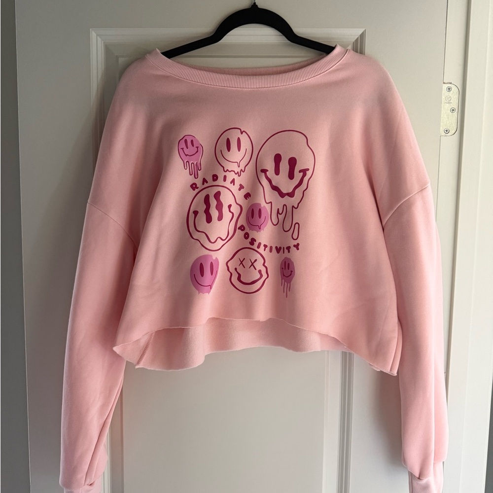 Light pink cropped sweatshirt.